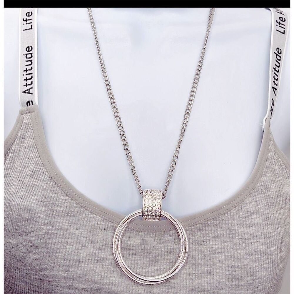 Silver multi ring  rhinestone embellished long necklace.